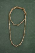 A rope twist and bar necklace stamped 9ct. 22 grams