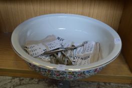A porcelain bowl and cutlery (AF).