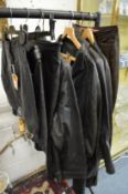 A quantity of ladies' black leather jackets and skirts etc.
