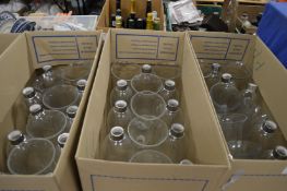 A large quantity of clear glass lampshades.