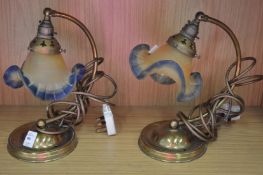 A pair of Art Nouveau style brass table lamps.