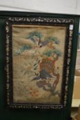An early Chinese embroidered panel mounted in a mother-of-pearl inlaid hardwood frame.