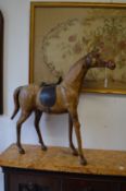 A leather model of a race horse.