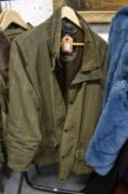 A Barbour waterproof and breathable jacket (size large) and two other items.
