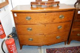 A mahogany three drawer bow front chest.