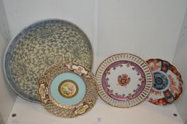 A porcelain cabinet plate with pierced border and four other plates.