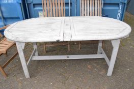 An oval painted wooden garden / patio table.