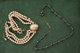 Two decorative necklaces.