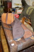 A leather cartridge bag and two gun slips.