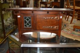 An Art Nouveau walnut table top cabinet.
