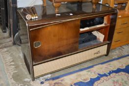 An old radiogram containing a modern amplifier and turntable.