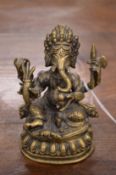 An Indian bronze model of Ganesh.