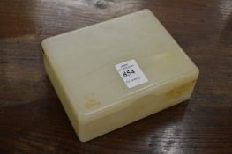 An alabaster cigarette box, the gilt metal hinge stamped Betjemann's Patent.