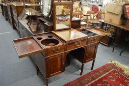 A Gillows of Lancaster gentleman's mahogany kneehole dressing table with bi-fold top and rising