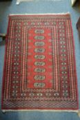 A small Bokhara rug.