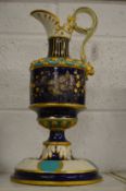 A decorative pottery ewer and stand.