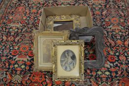 A small group of decorative frames and prints.