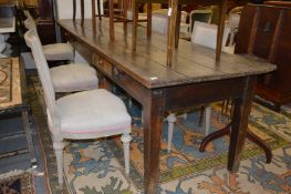 A good 19th century long oak plank top table with two frieze drawers on tapering square legs. 9ft