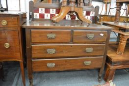 A stained pine chest with tiled splash back.