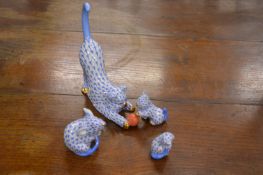 A small group of Herend cats and a mouse.