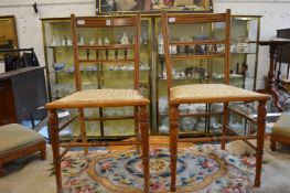 A pair of satinwood and inlaid occasional chairs.