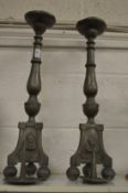 A pair of pewter pricket style candlesticks.