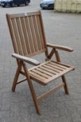 A set of five folding wooden garden chairs.