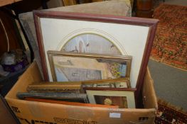 A box of paintings and prints.