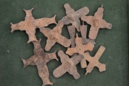 A group of large bronze crosses.