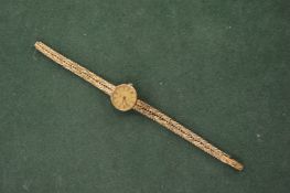 A ladies' Rotary wristwatch, the strap and case stamped 9ct. Gross weight 24 grams