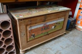A painted pine toy box.