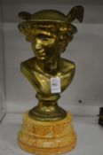 A brass bust of Mercury on a faux marble base.