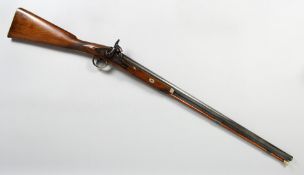 A 19TH CENTURY PERCUSSION RIFLE with round barrel, engraved lock plate and hammer, brass trigger