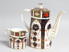 A ROYAL CROWN DERBY OLD IMARI PATTERN COFFFEE POT AND MILK JUG, NO. 1128.