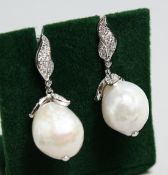 A PAIR OF SILVER BAROQUE PEARL EARRINGS
