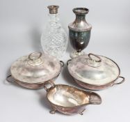 A PLATED SAUCEBOAT, A PAIR OF CIRCULAR VEGETABLE DISHES AND COVERS, A DECANTER with silver band,