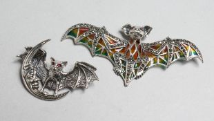 TWO SILVER MARCASITE AND ENAMEL BAT BROOCHES.
