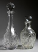 TWO CUT GLASS DECANTERS AND STOPPERS.
