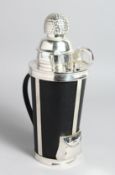 A NOVELTY GOLF THEMED COCKTAIL SHAKER with accessories, 12ins high.