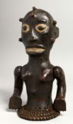 A RARE SKIN COVERED TRIBAL FIGURE with articulated arm.
