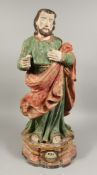 AN 18TH CENTURY CARVED WOOD POLYCHROME FIGURE OF SAINT JOSEPH. 29ins high.