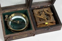 TWO BOXED COMPASSES.