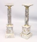 A GOOD PAIR OF MARBLE AND ORMOLU COLUMNS with square tops on reeded columns with stepped square