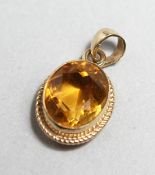 A 9CT GOLD MOUNTED CITRINE PENDANT
