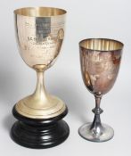A CHALLENGE CUP on a circular base, 18ins high, with engraved inscription: ROYAL ARMY AND NAVY