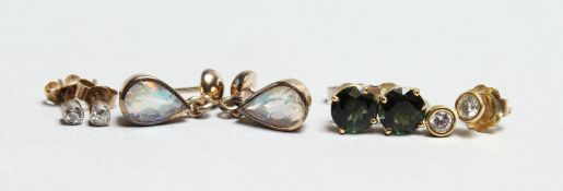 TWO SMALL DIAMOND EARRINGS and two others.