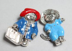 TWO SILVER ENAMEL PADDINGTON BEAR AND TOMMY KITTEN BROOCHES.