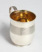 A WILLIAM V REEDED CHRISTENING MUG with gilt interior. London 1834, maker I. W. & J. H.