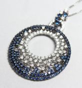 A SUPERB 18CT WHITE GOLD SAPPHIRE AND DIAMOND CIRCLE PENDANT AND CHAIN.