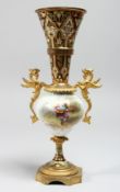A CONTINENTAL ORMOLU, PORCELAIN AND ENAMEL TWIN HANDLED VASE, with phoenix handles, the body painted